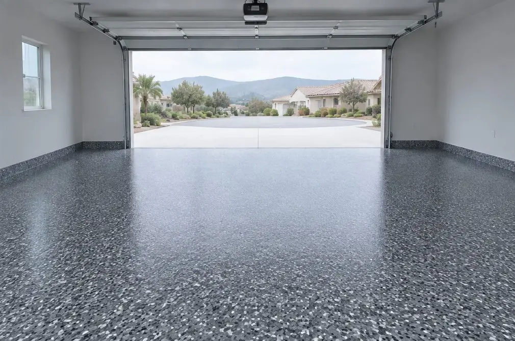 Illustration: a two-car garage with a full-broadcast flake floor in charcoal, gray and white chips