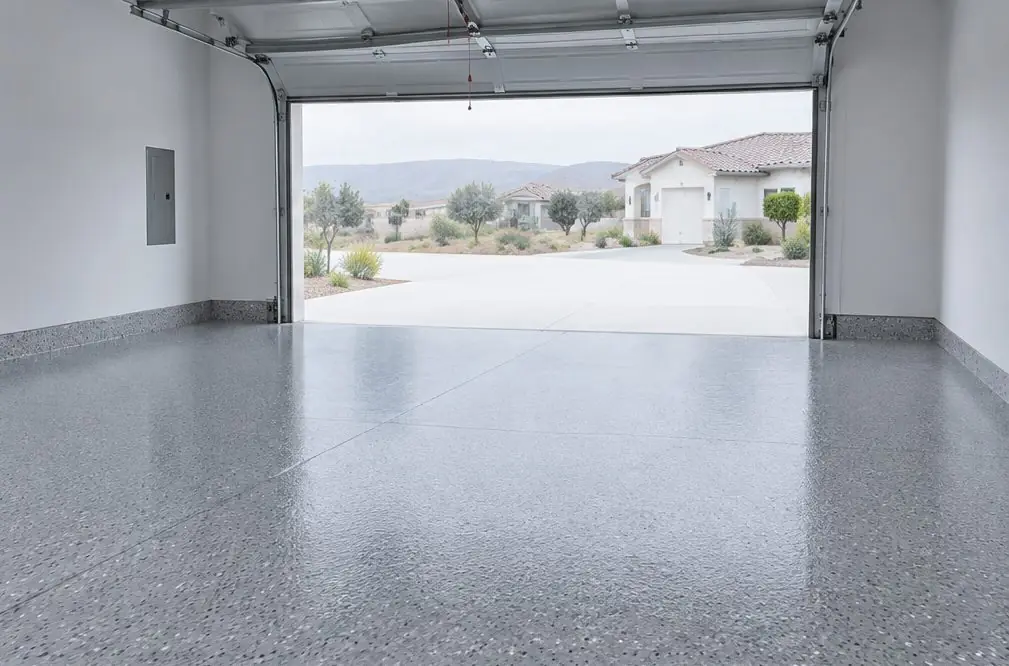 Illustration: a finished, evenly colored garage floor with a clean sheen and no blisters